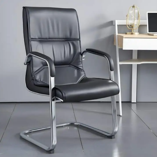 A high back leather conference chair in a stylish office setting, showcasing its premium leather finish and ergonomic design.