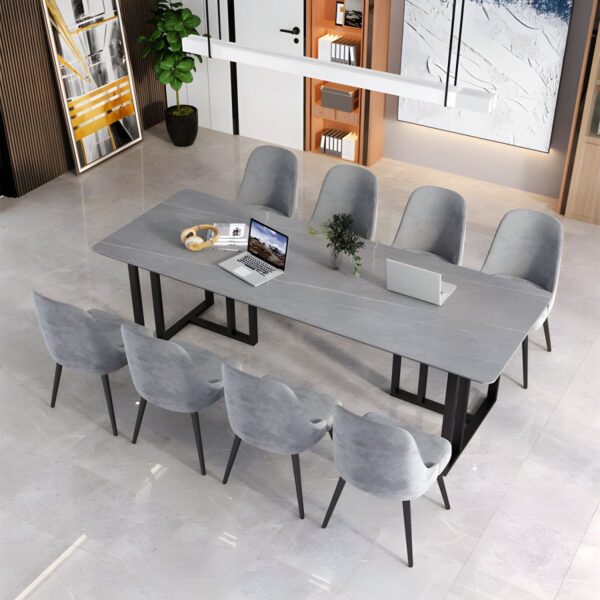 Modern office meeting table with a sleek design and ample workspace in a professional setting.