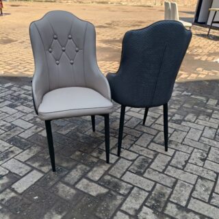 Modern Marble Leather Dining Chairs featuring a sleek design and marble-patterned upholstery in an elegant dining room setting.