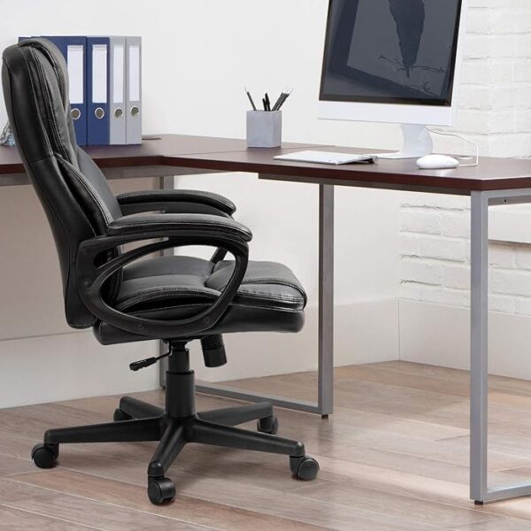 Black Leather Executive Office Seat with polished chrome base, designed for comfort and style in a modern office environment.