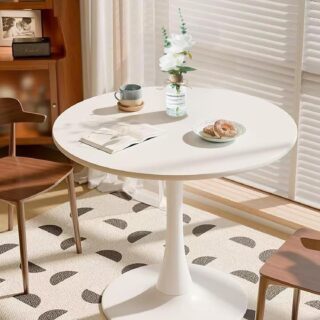 Modern round coffee/tea table featuring a sleek design and stylish finish.