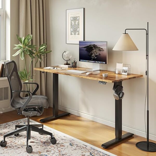 140cm Height Adjustable Electric Desk with a spacious tabletop and electric lift mechanism, set in a modern office environment.