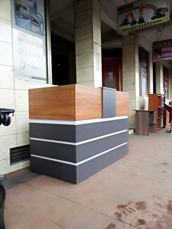 1800mm Office Wooden Reception Desk with a polished surface and built-in storage compartments in a modern office setting.