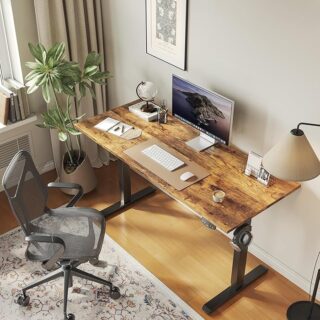 140cm Height Adjustable Electric Desk with a spacious tabletop and electric lift mechanism, set in a modern office environment.