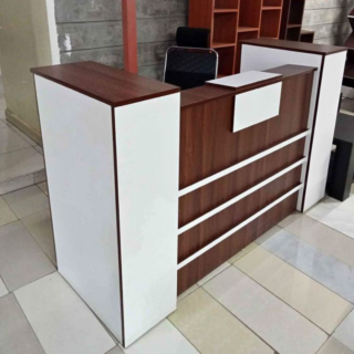 1800mm Wooden Reception Office Desk with natural finish and integrated storage, designed for elegance and functionality in a reception area.