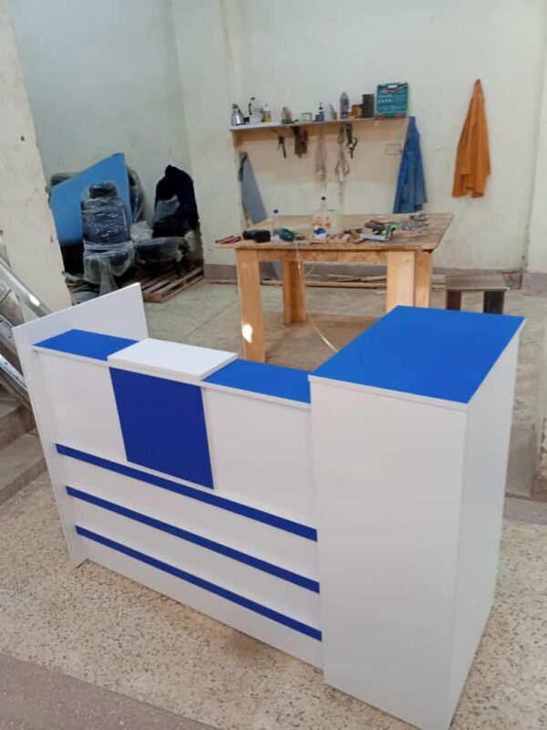 Rectangular Wooden Reception Desk in a modern office setting, showcasing its spacious design and elegant finish.