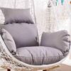 Cozy outdoor hammock swing hanging between two trees, inviting relaxation in a sunny garden.