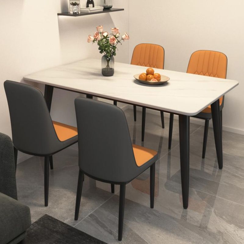 "4-seat rectangular dining table with modern design and wooden surface."