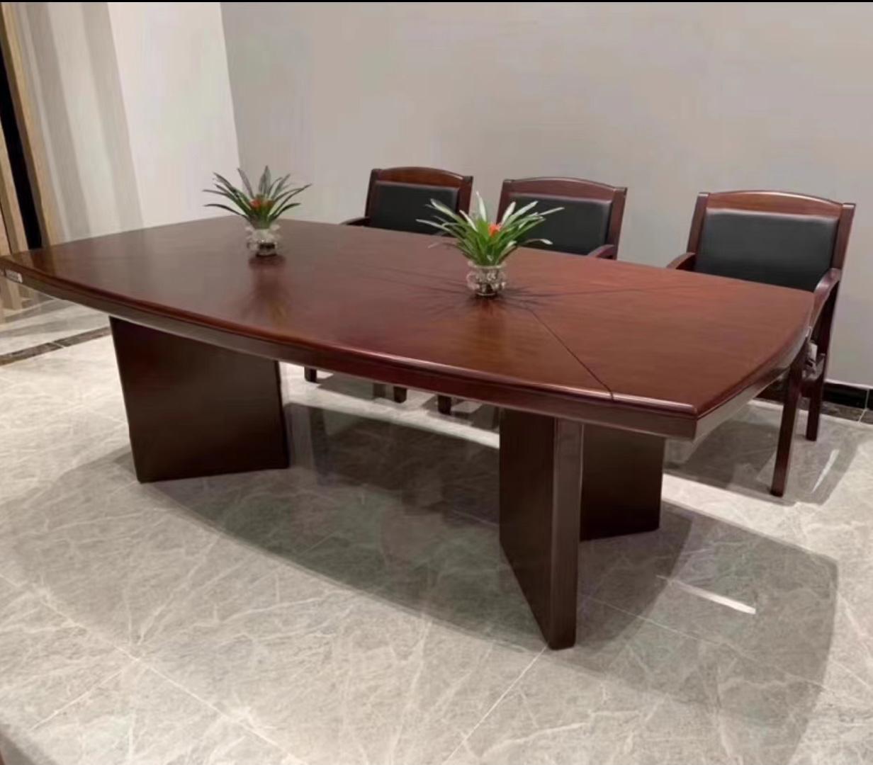 "Large boardroom office table with a sleek design, spacious surface, and elegant finish, perfect for meetings and corporate settings."