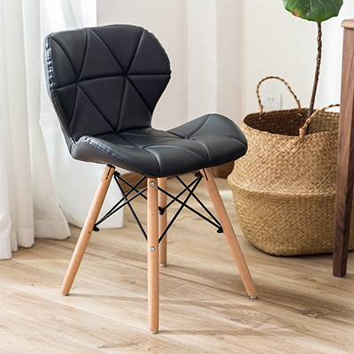 Cassa Eames Leather Padded Chair with sleek design and plush cushioning in a modern living space.