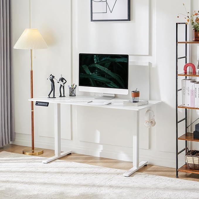 : "Stray White Electric Adjustable Desk – a sleek, height-adjustable sit-stand desk with a spacious white surface and sturdy metal legs, ideal for ergonomic and modern workspaces."