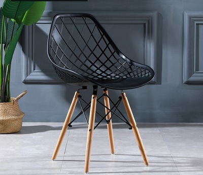 Eames Plastic Shell Dining Chair in modern setting with sleek design and vibrant color.