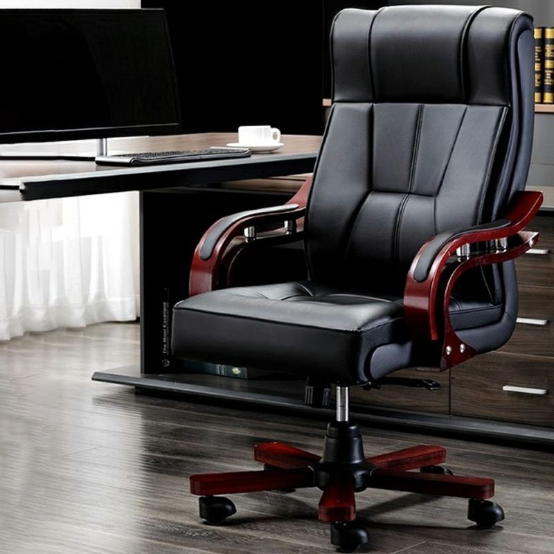 "Faux leather executive office chair with adjustable height and cushioned armrests"