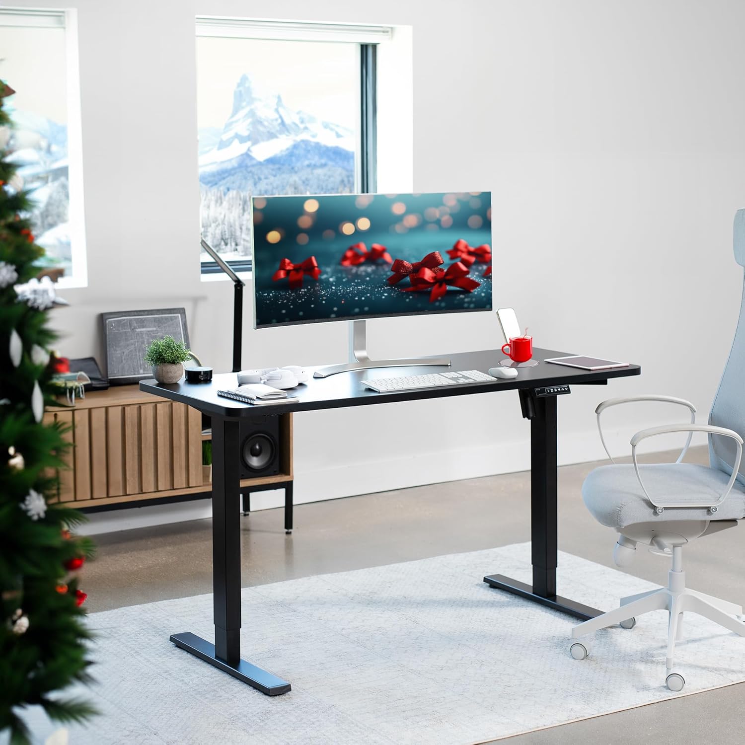 Adjustable office desk with motorized height control for ergonomic sitting and standing positions.