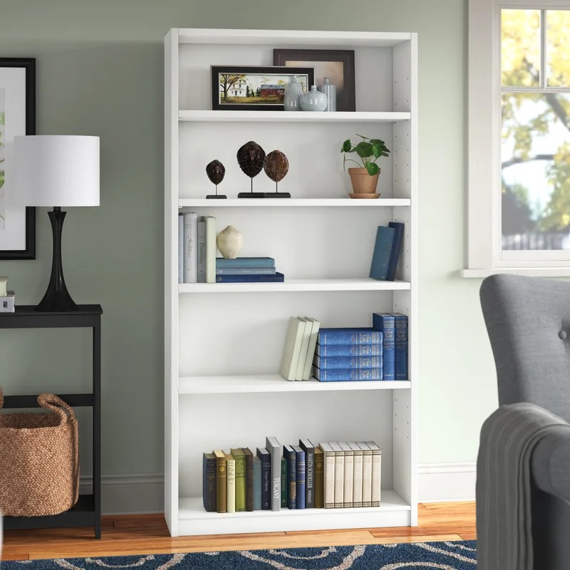 "Modern display bookshelf with open shelving for books and decor in a stylish home setting."