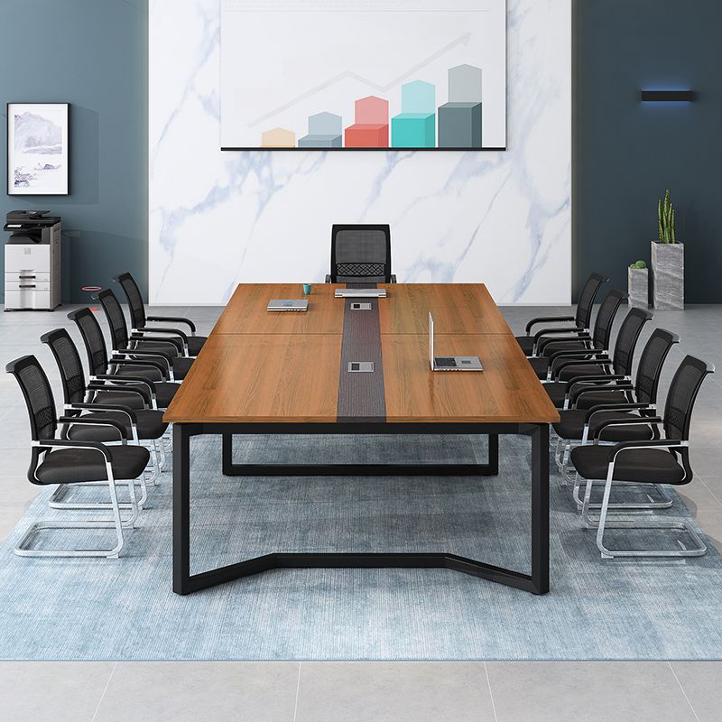 Brown wooden boardroom table with elegant finish, spacious design, and sturdy construction, perfect for corporate meetings.