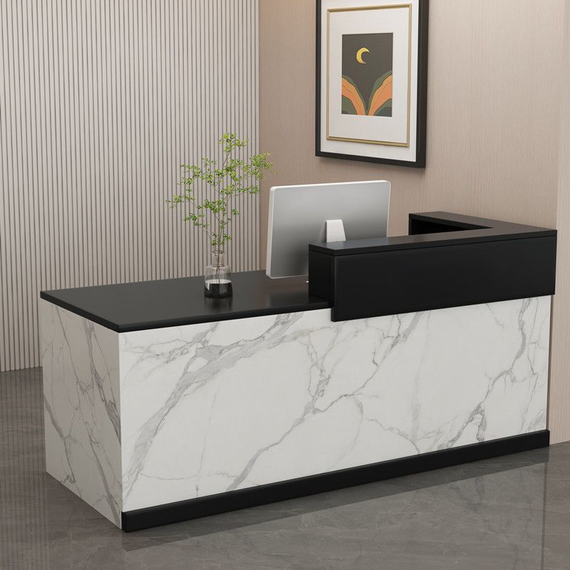 Professional receptionist office desk with ample workspace and built-in storage in a modern office setting.