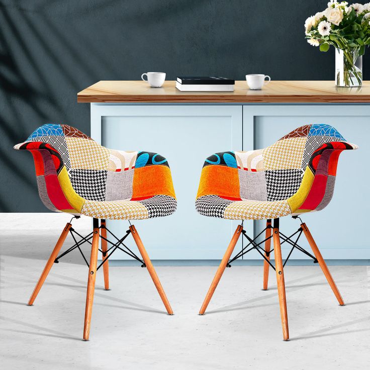 Modern Bistro Eames Dining Chair with molded plywood seat and sleek metal legs, offering a blend of comfort and style.