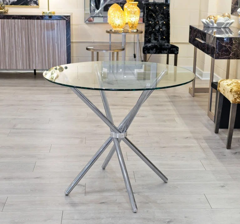 "Foldable glass dining table with a sleek tempered glass top and a sturdy metal frame, ideal for small spaces and modern interiors."