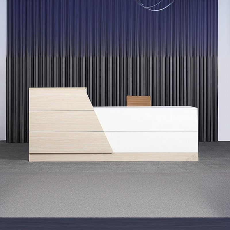 "Modern office reception desk with built-in hutch and cable management."