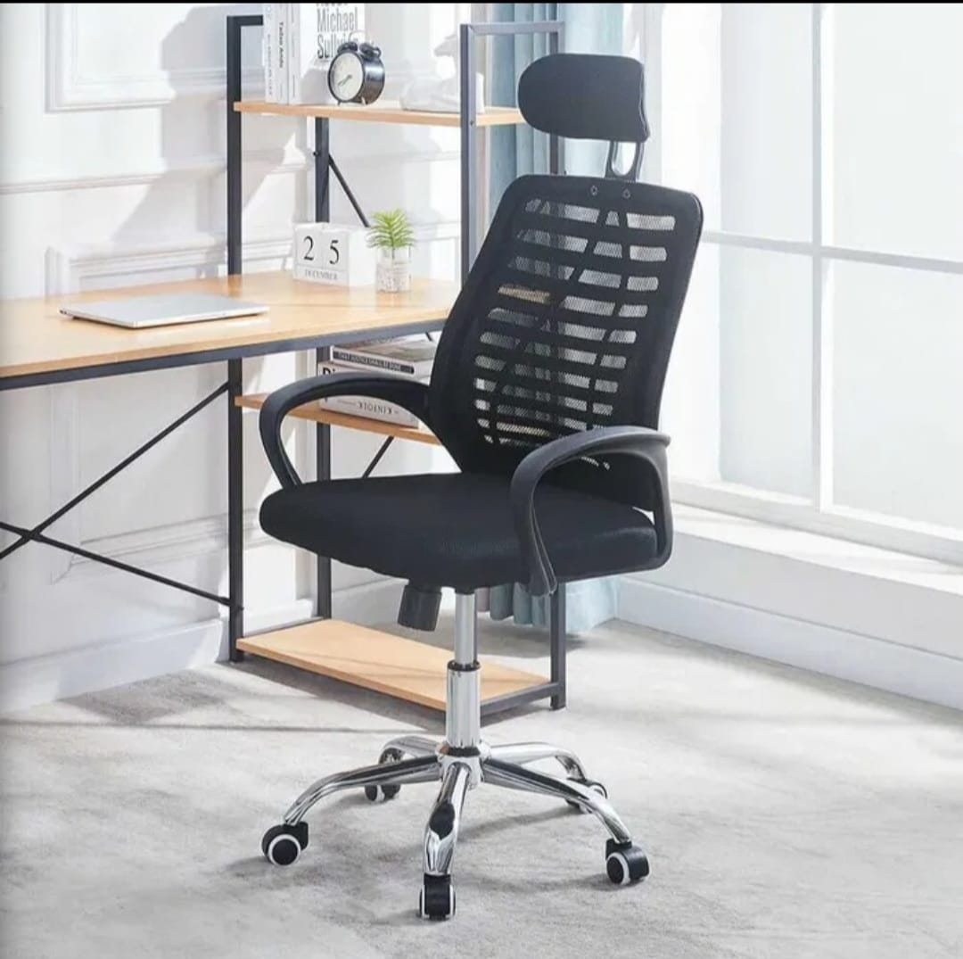 A black ergonomic office chair with a headrest and adjustable arms.