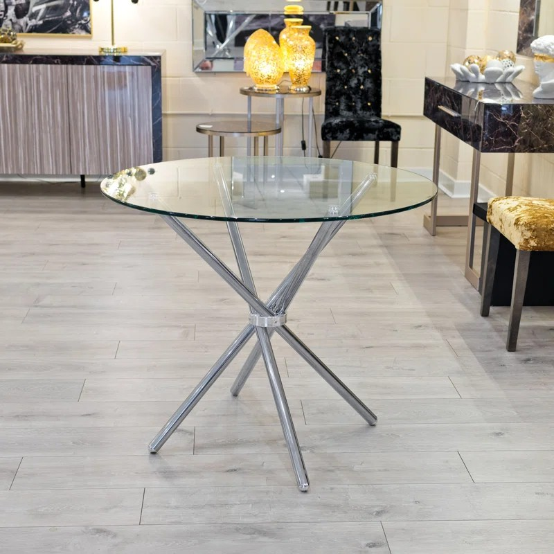 Foldable glass dining table with a sleek tempered glass top and sturdy frame, perfect for modern and space-saving interiors.