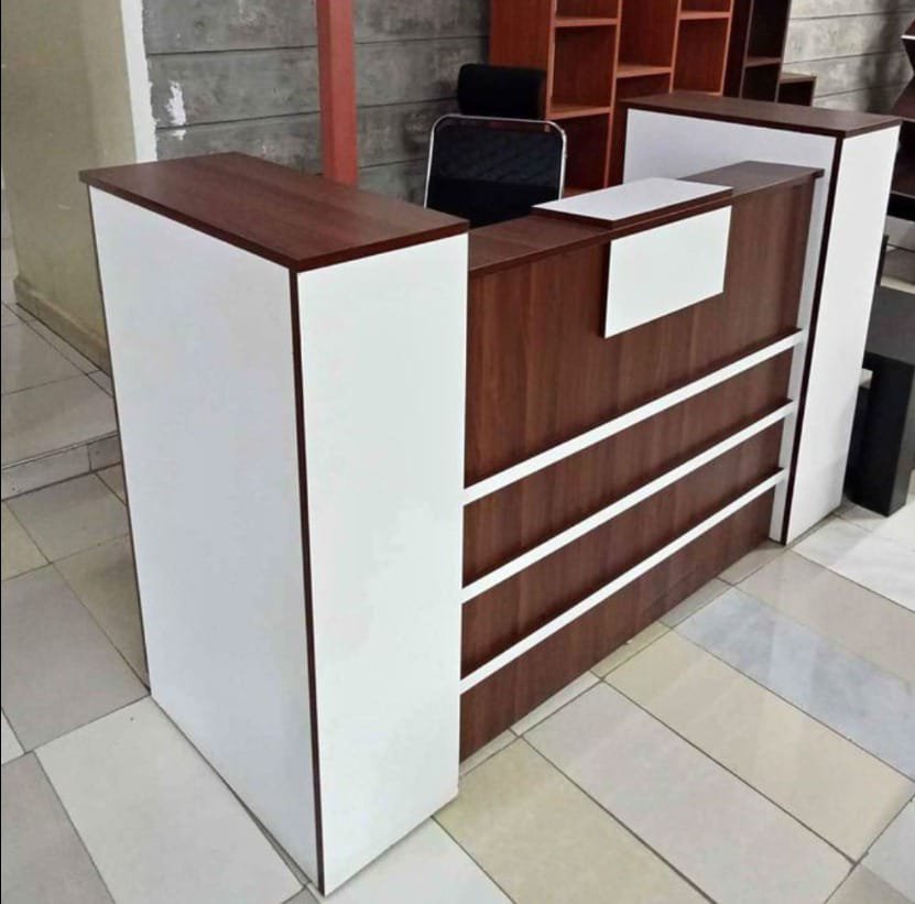 "1.6 Meter Reception Office Desk with a modern design and integrated storage in a contemporary office lobby."