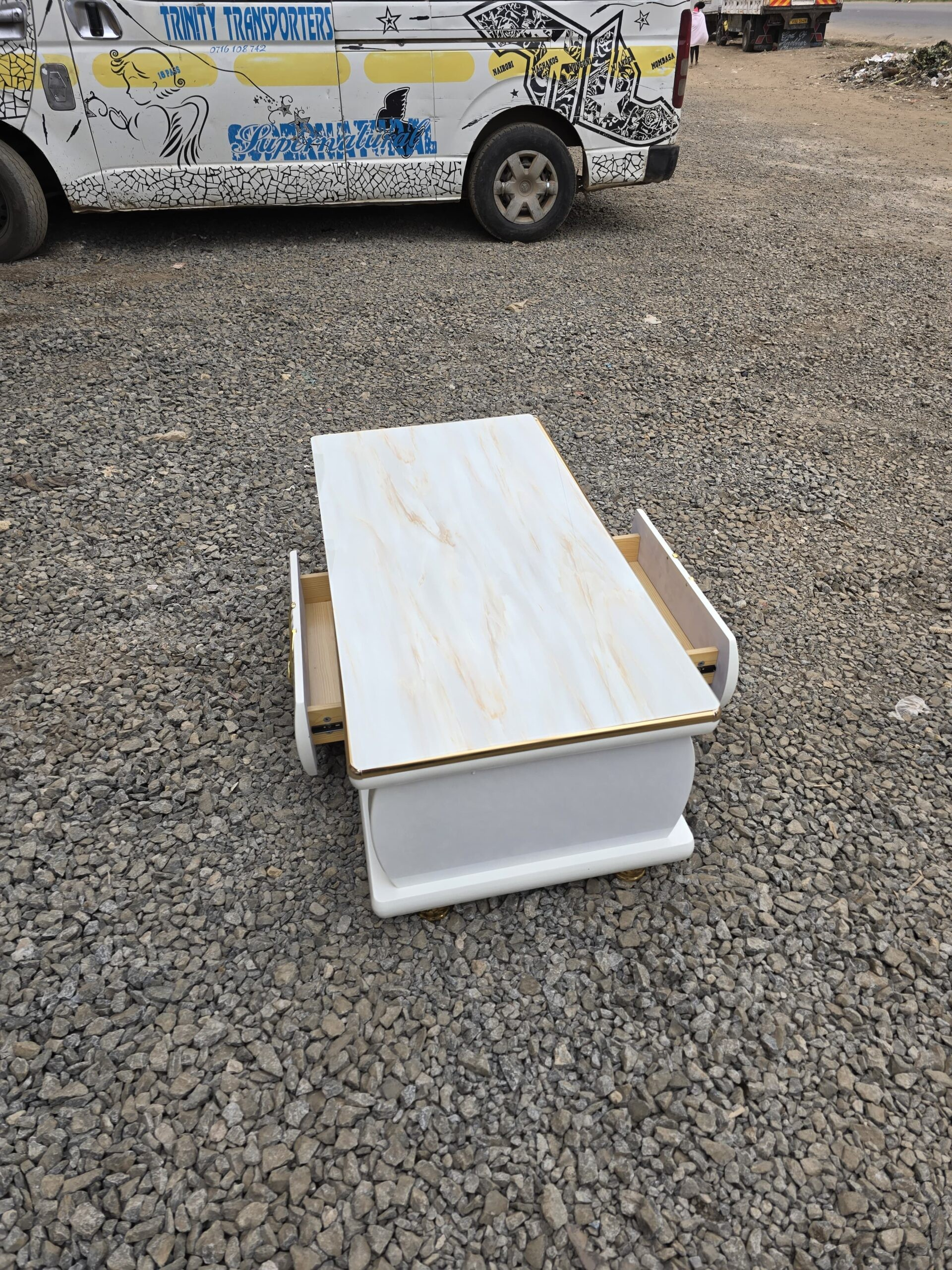 coffee table, coffee tables, modern coffee table, contemporary coffee table, wooden coffee table, glass coffee table, metal coffee table, marble coffee table, round coffee table, square coffee table, rectangular coffee table, oval coffee table, center table, living room coffee table, lounge coffee table, sofa table, tea table, cocktail table, minimalist coffee table, luxury coffee table, premium coffee table, designer coffee table, stylish coffee table, elegant coffee table, classic coffee table, contemporary living room table, modern living room table, home furniture coffee table, living room furniture table, centerpiece coffee table, decorative coffee table, functional coffee table, multi purpose coffee table, storage coffee table, coffee table with drawers, coffee table with shelf, coffee table with storage, lift top coffee table, adjustable coffee table, nesting coffee table, stackable coffee table, space saving coffee table, compact coffee table, small coffee table, large coffee table, oversized coffee table, low profile coffee table, high quality coffee table, durable coffee table, sturdy coffee table, heavy duty coffee table, strong coffee table, solid wood coffee table, engineered wood coffee table, MDF coffee table, plywood coffee table, tempered glass coffee table, clear glass coffee table, smoked glass coffee table, frosted glass coffee table, metal frame coffee table, steel coffee table, iron coffee table, chrome coffee table, black coffee table, white coffee table, brown coffee table, walnut coffee table, oak coffee table, mahogany coffee table, teak coffee table, rustic coffee table, industrial coffee table, Scandinavian coffee table, mid century coffee table, vintage coffee table, retro coffee table, farmhouse coffee table, urban coffee table, modern minimalist coffee table, sleek coffee table, glossy coffee table, matte finish coffee table, polished coffee table, hand crafted coffee table, custom coffee table, bespoke coffee table, luxury living room table, premium living room furniture, home decor coffee table, interior design coffee table, stylish home furniture, living room centerpiece table, coffee table for sofa set, coffee table for living room, coffee table for apartment, coffee table for home, coffee table for office lounge, coffee table for reception area, coffee table for hotel lobby, coffee table for waiting area, coffee table for guest room, coffee table for studio apartment, coffee table for small spaces, coffee table for large living room, coffee table for modern homes, coffee table for classic interiors, coffee table with smooth edges, child friendly coffee table, safe edge coffee table, scratch resistant coffee table, stain resistant coffee table, easy clean coffee table, low maintenance coffee table, long lasting coffee table, eco friendly coffee table, sustainable wood coffee table, modern home coffee table, stylish lounge table, luxury lounge furniture, premium center table, decorative center table, functional center table, coffee table furniture, living room table furniture, coffee table furniture supplier, coffee table furniture manufacturer, coffee table furniture retailer, coffee table furniture distributor, coffee table showroom, coffee table online, coffee table for sale, coffee table wholesale, coffee table bulk supply, affordable coffee table, budget coffee table, value for money coffee table, high end coffee table, best coffee table, trending coffee table, latest coffee table design, new coffee table styles, popular coffee table, modern interior coffee table, contemporary decor coffee table, coffee table Kenya, coffee table Nairobi, coffee table Kenya supplier, coffee table Kenya store, coffee table Kenya shop, coffee table online Kenya, coffee table wholesale Kenya, coffee table distributor Kenya, coffee table manufacturer Kenya, coffee table for sale Kenya, affordable coffee table Kenya, luxury coffee table Kenya, modern coffee table Kenya, wooden coffee table Kenya, glass coffee table Kenya, marble coffee table Kenya, living room coffee table Kenya, coffee table delivery Kenya, coffee table installation Kenya, coffee table interior design Kenya, coffee table home furniture Kenya, coffee table office lounge Kenya, coffee table hospitality furniture Kenya, coffee table residential furniture Kenya